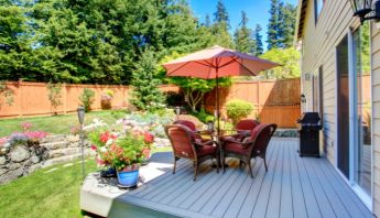 Landscaping tips to increase property value blog - picture of backyard with deck, fence & gardens